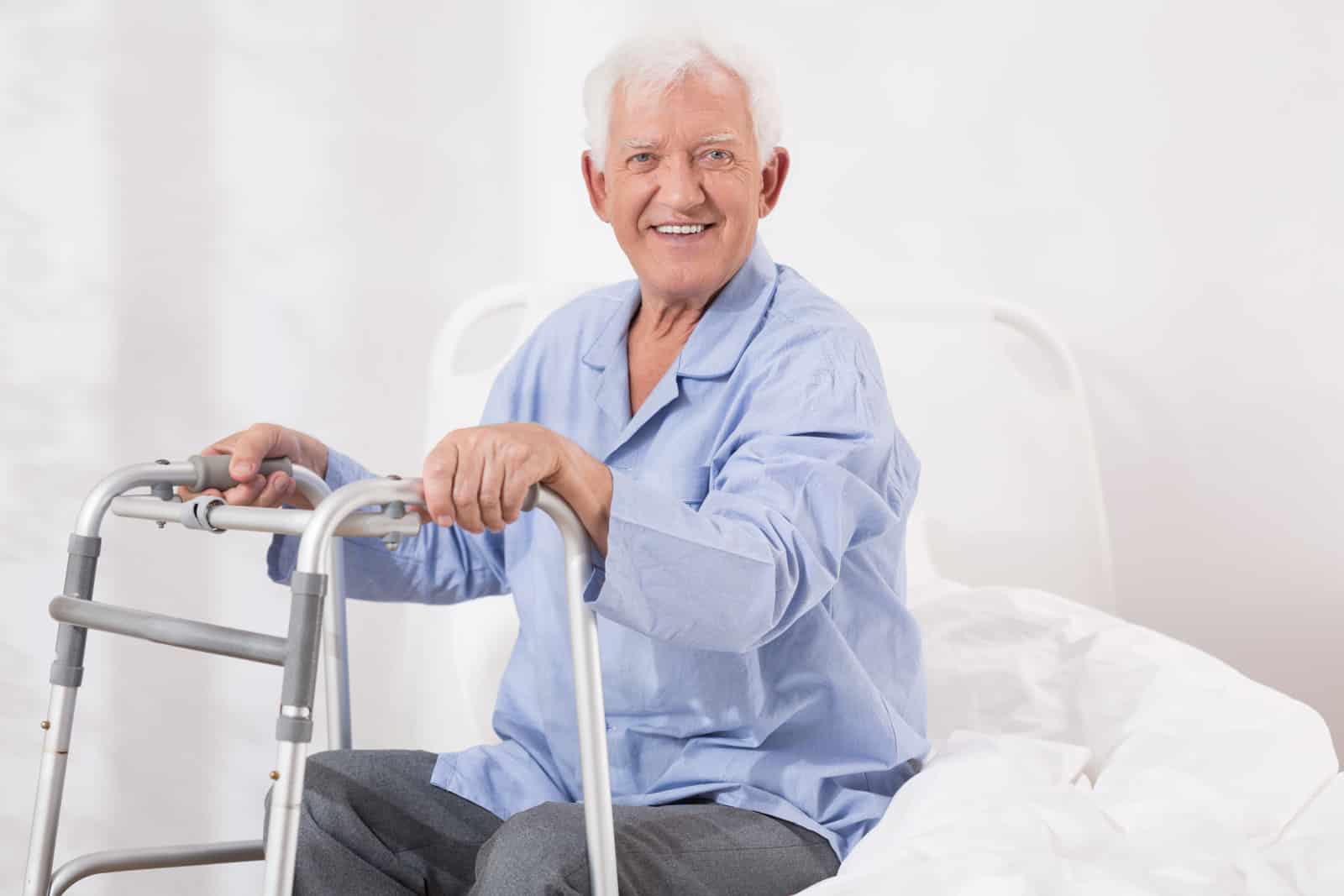 Hospital patient with a walking frame