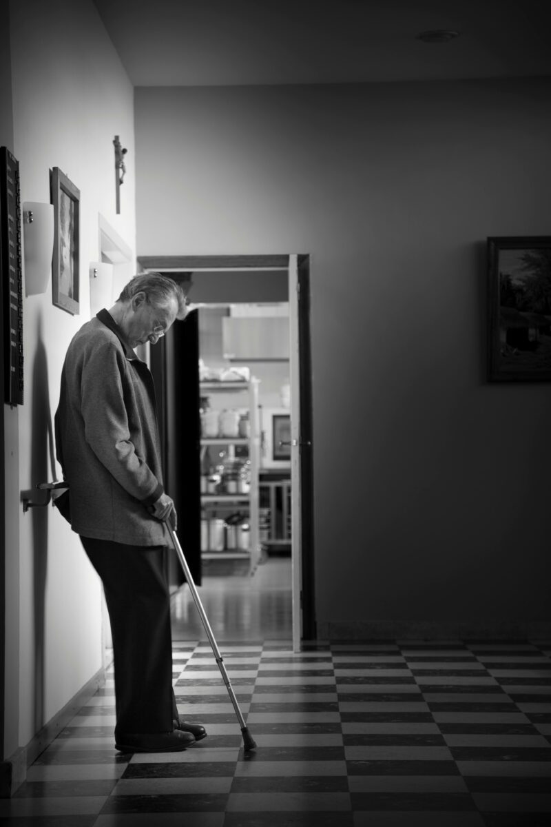 Elderly with a walking stick