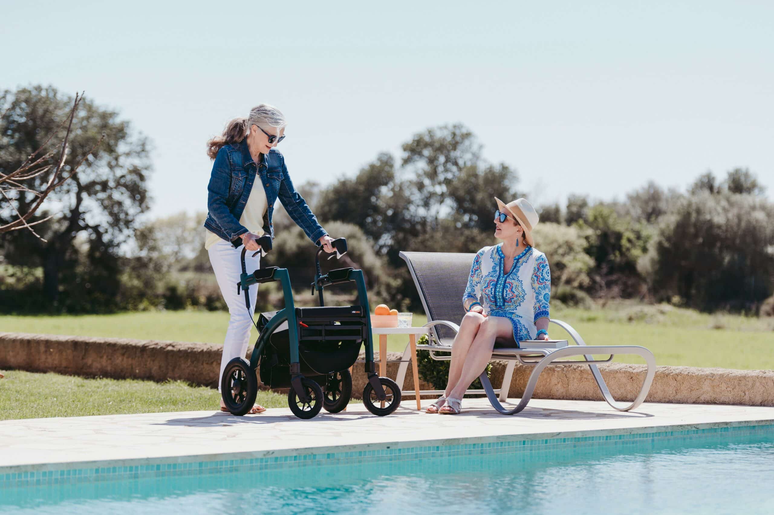 Lady using a rollator by the pool