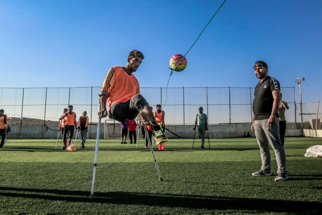 Playing soccer with a crutch